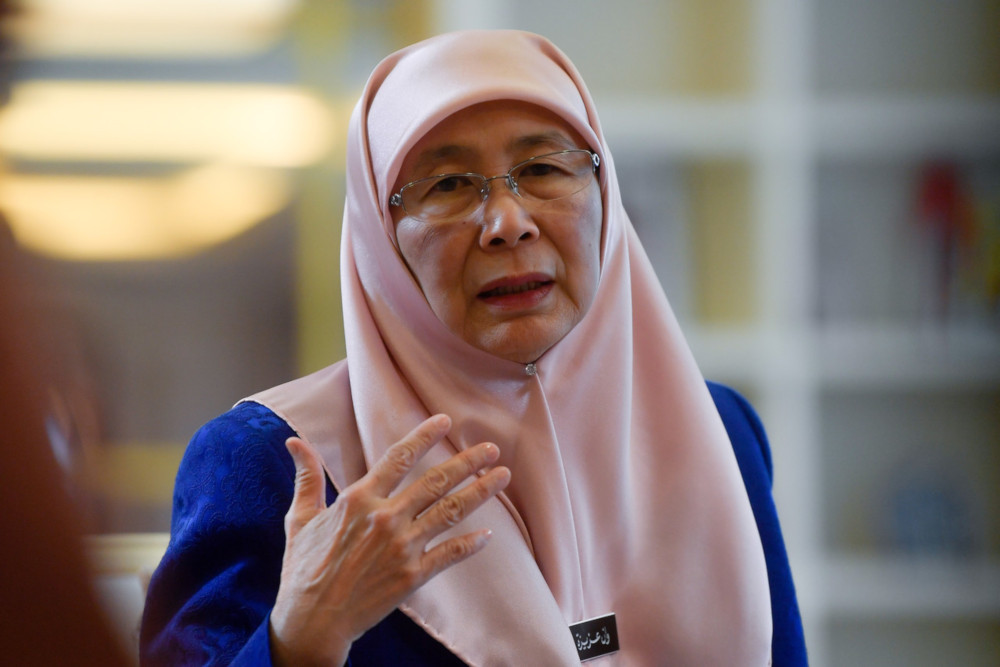 Deputy Prime Minister Datuk Seri Dr Wan Azizah Wan Ismail, who is also office at the Women, Family and Community Development Minister, speaks to reporters at her office in Putrajaya January 24, 2020. u00e2u20acu201d Bernama pic