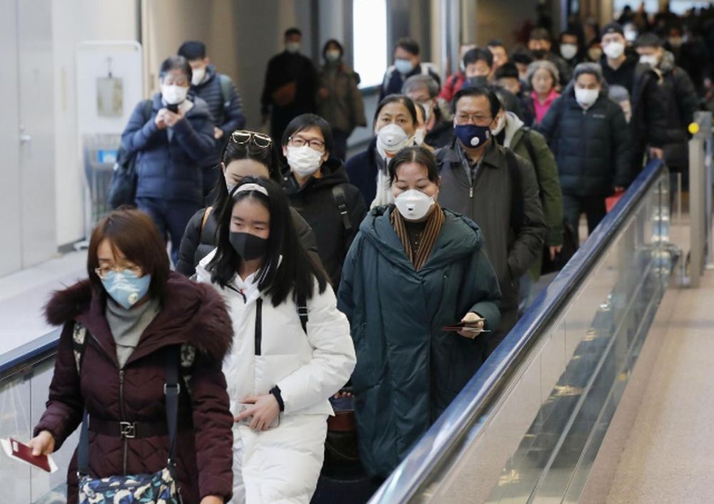 Passengers arriving from the Chinese city of Wuhan arrive at Narita Airport in Chiba, Japan in this photo taken by Kyodo January 23, 2020. u00e2u20acu201d Kyodo pic via Reuters