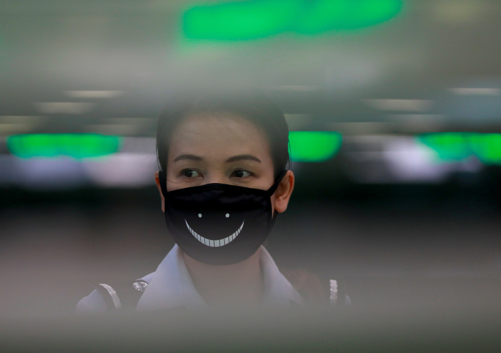 An airport officer wears a mask to prevent the spread of the new coronavirus as she works at the Suvarnabhumi Airport in Bangkok February 3, 2020. u00e2u20acu201d Reuters pic