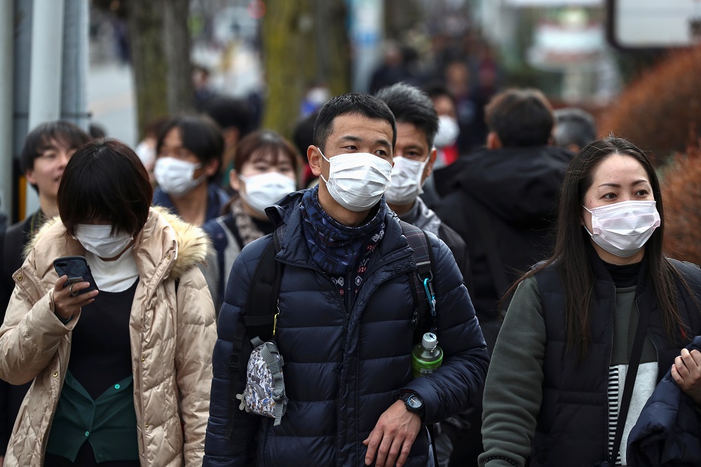 People wearing protective face masks are seen before a rehearsal of the Tokyo 2020 Olympic Torch Relay in Hamura, outskirts of Tokyo February 15, 2020. u00e2u20acu201d Reuters pic