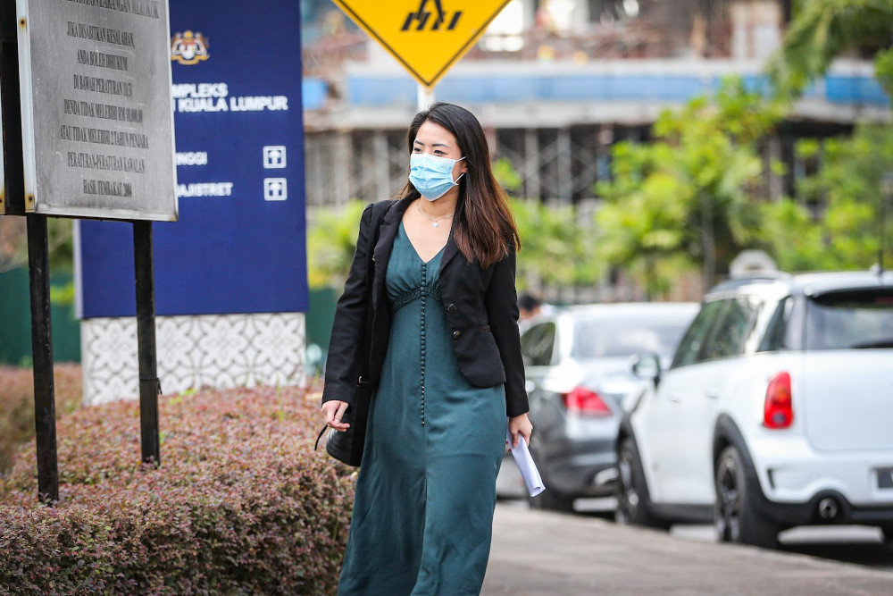 Former AmBank relationship manager Krystle Yap leaves the Kuala Lumpur Court Complex after attending the SRC International trial on February 4, 2020. u00e2u20acu201d Picture by Hari Anggara