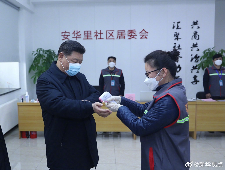 Chinese President Xi Jinping wearing a protective facemask as a health official checks his body temperature during an inspection of the novel coronavirus pneumonia prevention work at the Anhuali Community in Beijing, February 10, 2020. u00e2u20acu201d Xinhua/AFP pic