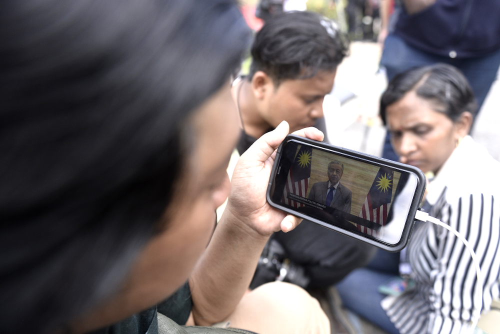 Members of media watch the live telecast of Interim Prime Minister Tun Dr Mahathir Mohammad at Istana Negara February 26, 2020. u00e2u20acu201d Picture by Miera Zulyana