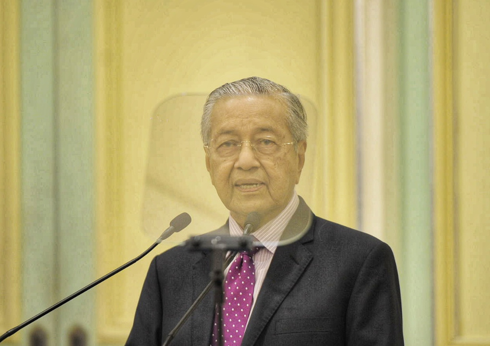 Interim Prime Minister Tun Mahathir Mohamad speaks during the economic stimulus package announcement at Perdana Putra building in Putrajaya February 27, 2020. u00e2u20acu201d Picture by Shafwan Zaidon