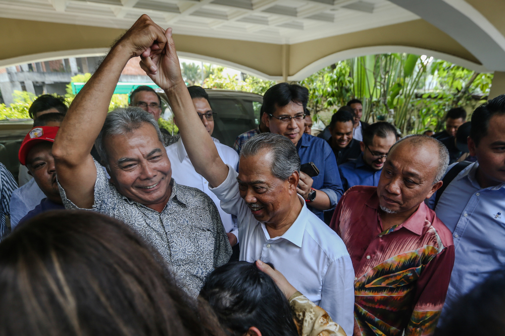 Datuk Seri Mohd Redzuan Md Yusof and Tan Sri Muhyiddin Yassin celebrate in front of the latteru00e2u20acu2122s house in Bukit Damansara February 29, 2020. u00e2u20acu201d Picture by Firdaus Latif 