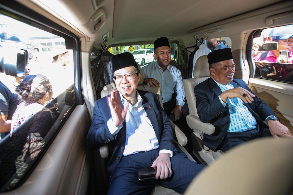 DAP secretary-general Lim Guan Eng and Parti Amanah Negara president Mohamad Sabu are seen leaving Istana Negara, February 29, 2020. u00e2u20acu201d Picture by Hari Anggara