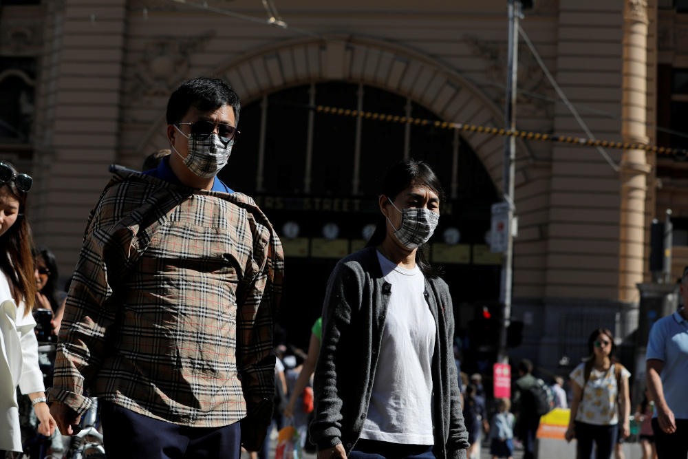 People wearing face masks walk by Flinders Street Station after cases of the coronavirus were confirmed in Melbourne, Victoria, Australia, January 29, 2020. u00e2u20acu201d Reuters pic