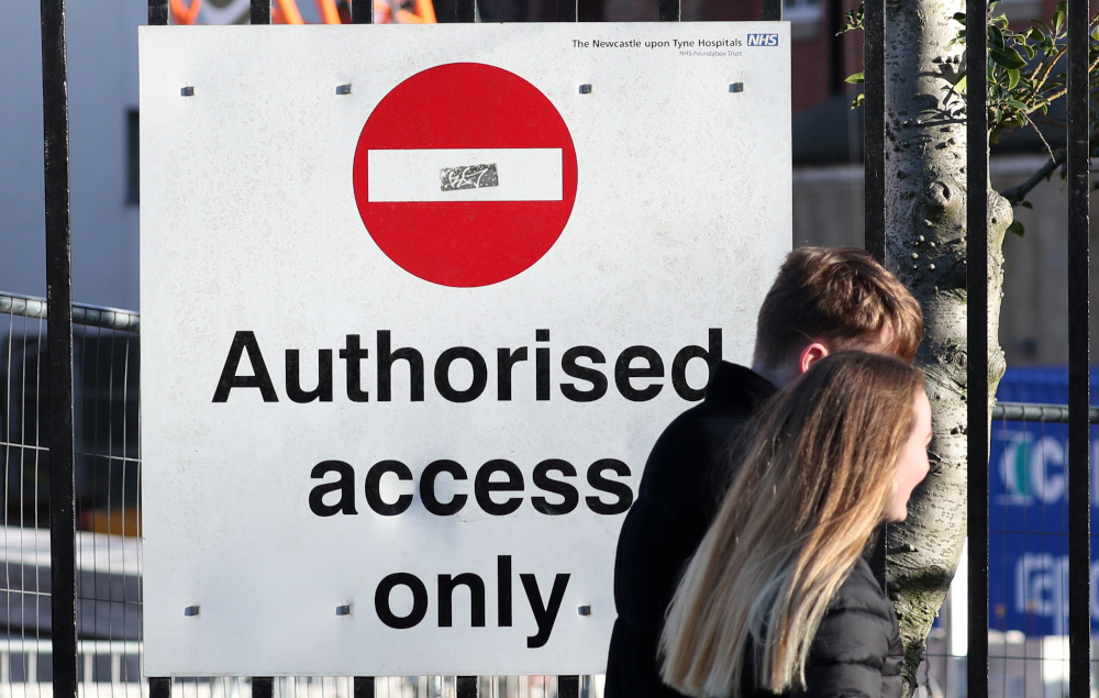 A couple pass a sign outside the Royal Victoria Infirmary, where two confirmed coronavirus patients are being treated, in Newcastle, Britain February 1, 2020. u00e2u20acu201d Reuters pic 