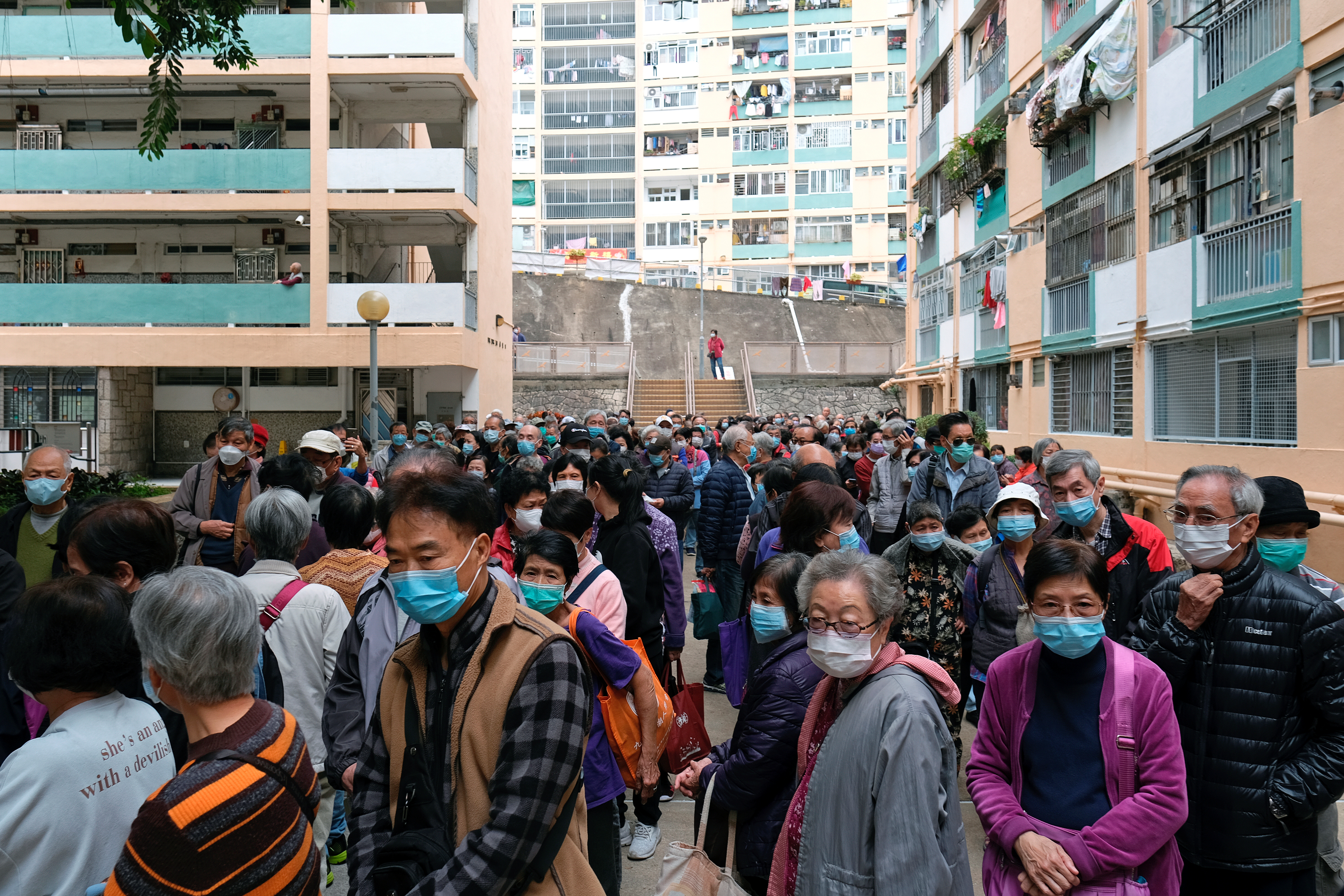 Elderly people queue up for free surgical masks from a convenience store, following the outbreak of a new coronavirus, in Hong Kong, China February 7, 2020. u00e2u20acu201d Reuters picnn