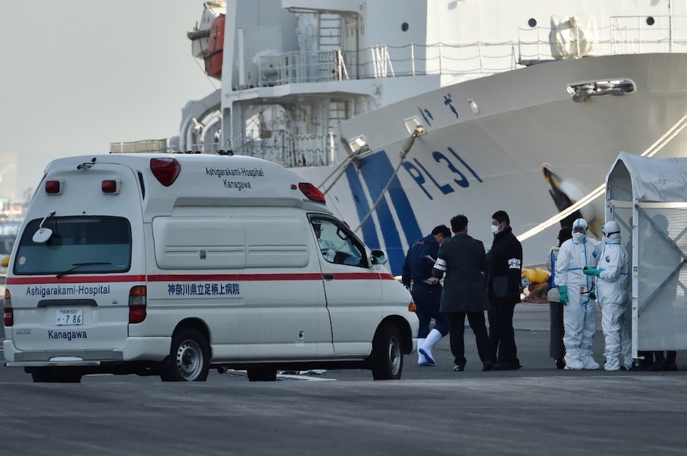 Personnel clad in protective gear and tasked to provide care for suspected patients on board the Diamond Princess cruise ship prepare to conduct a transfer at the Daikoku Pier Cruise Terminal in Yokohama on February 7, 2020. u00e2u20acu201d Reuters picnn