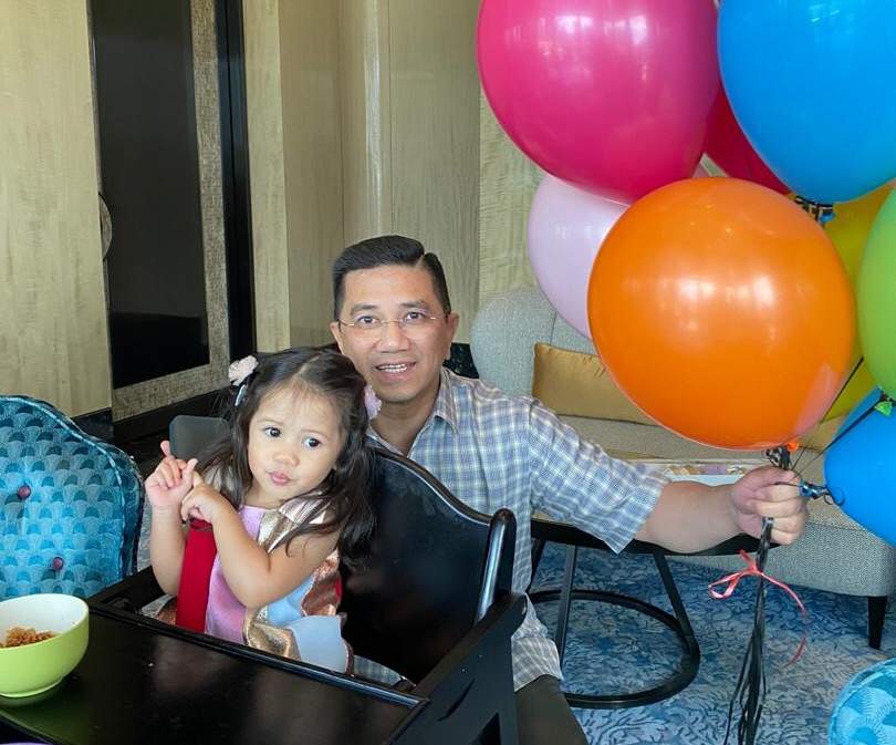 PKR deputy president Datuk Seri Azmin Ali with his birthday grandchild and balloons. u00e2u20acu201d Picture courtesy of twitter.com/AzminAli