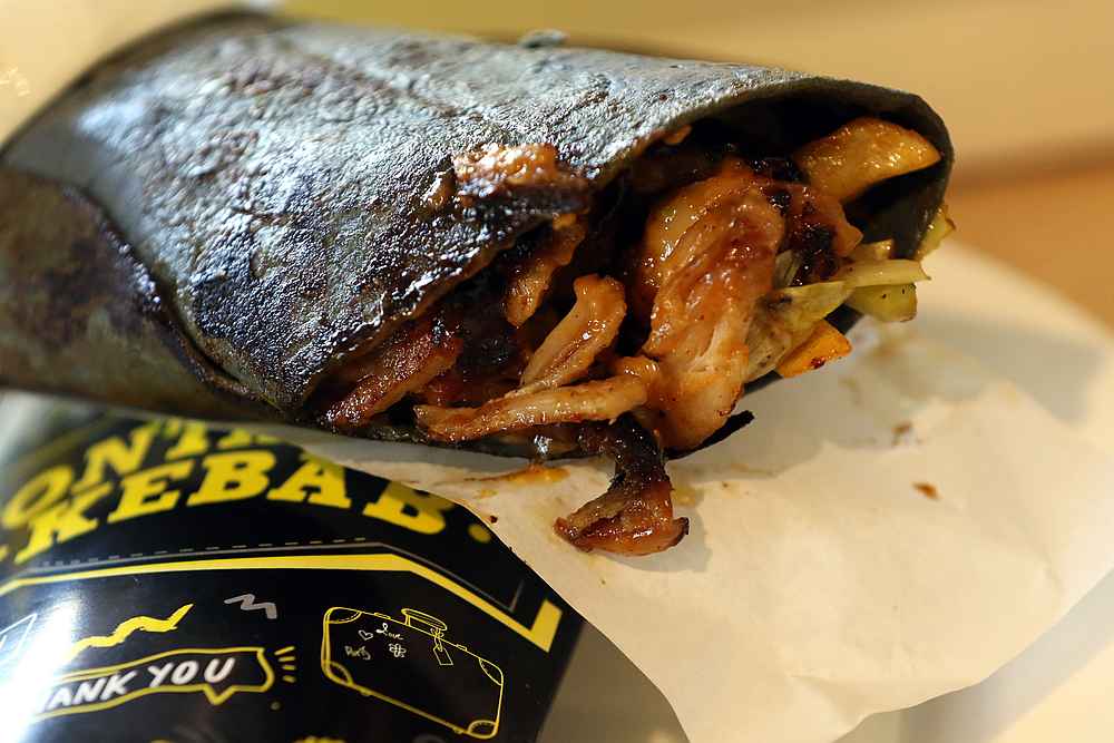 The signature Black Kebab is a charcoal tortilla with a choice of chicken or beef kebab or both and comes with fries and a salad. u00e2u20acu201d Picture by Farhan Najib Yusoff