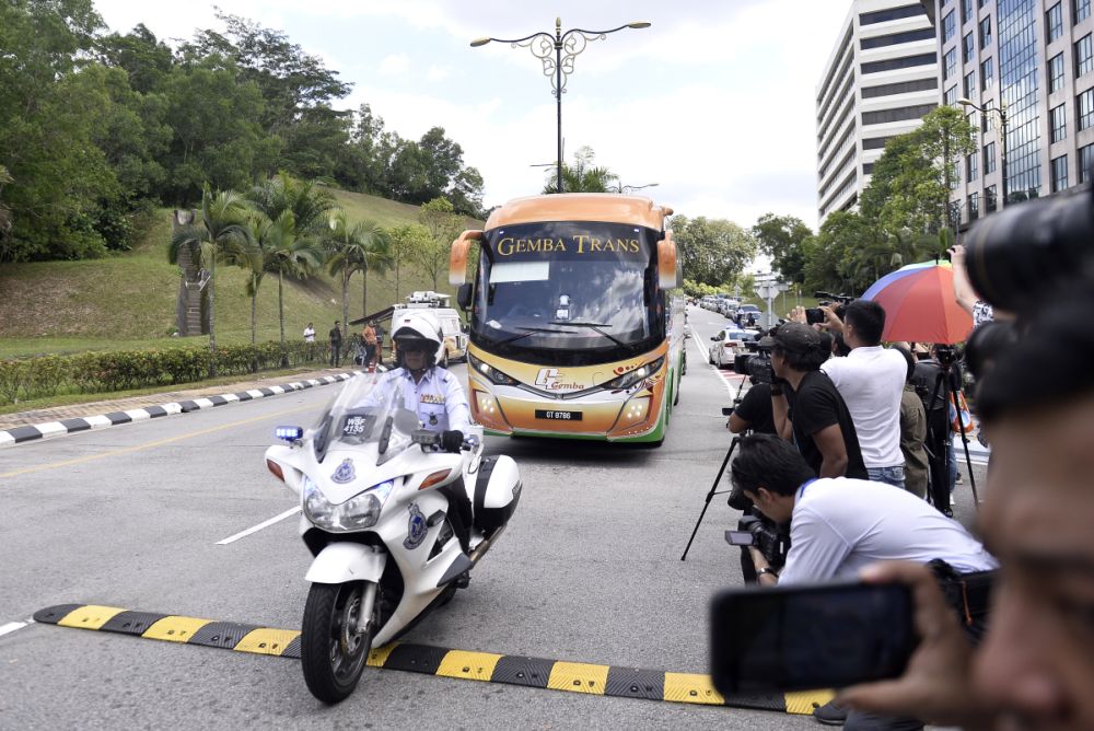 A bus ferrying Barisan Nasional and PAS MPs arrives at Istana Negara February 25, 2020. u00e2u20acu2022 Picture Miera Zulyana