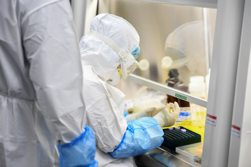 This photo taken February 6, 2020 shows a laboratory technician working on samples from people to be tested for the new coronavirus at u00e2u20acu02dcFire Eyeu00e2u20acu2122 laboratory in Wuhan in Chinau00e2u20acu2122s central Hubei province. u00e2u20acu201d AFP pic 