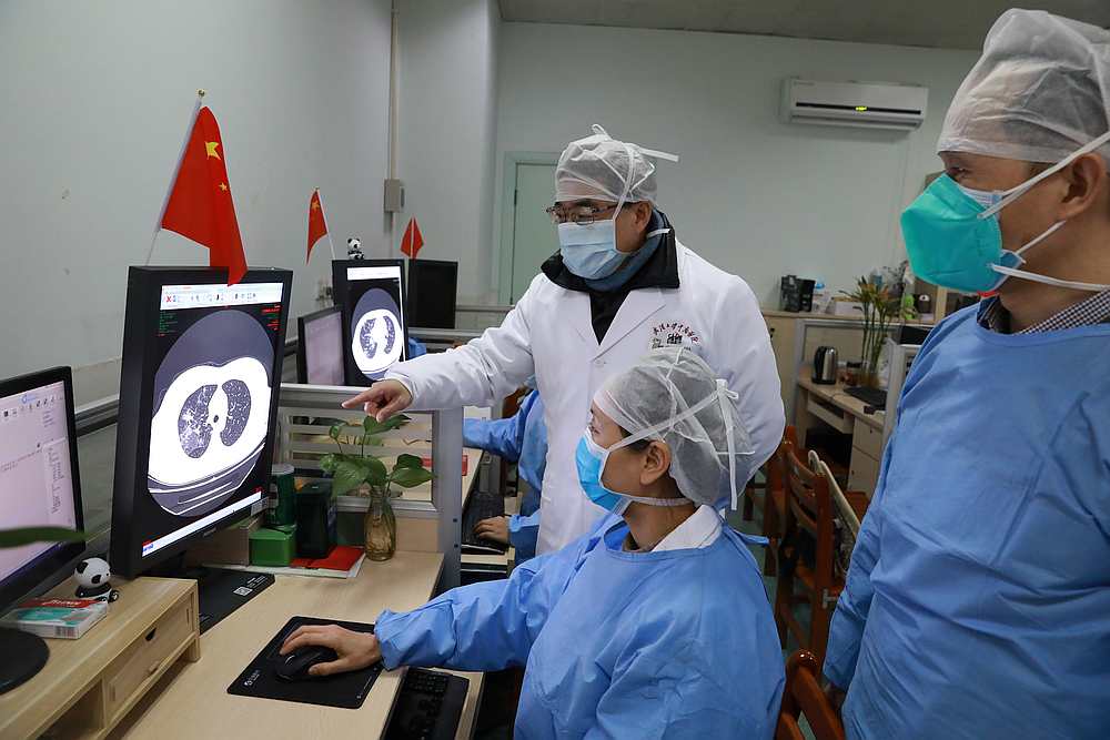Medical workers inspect the CT (computed tomography) scan image of a patient at the Zhongnan Hospital of Wuhan University, Hubei province, China February 2, 2020. u00e2u20acu201d China Daily pic via Reuters