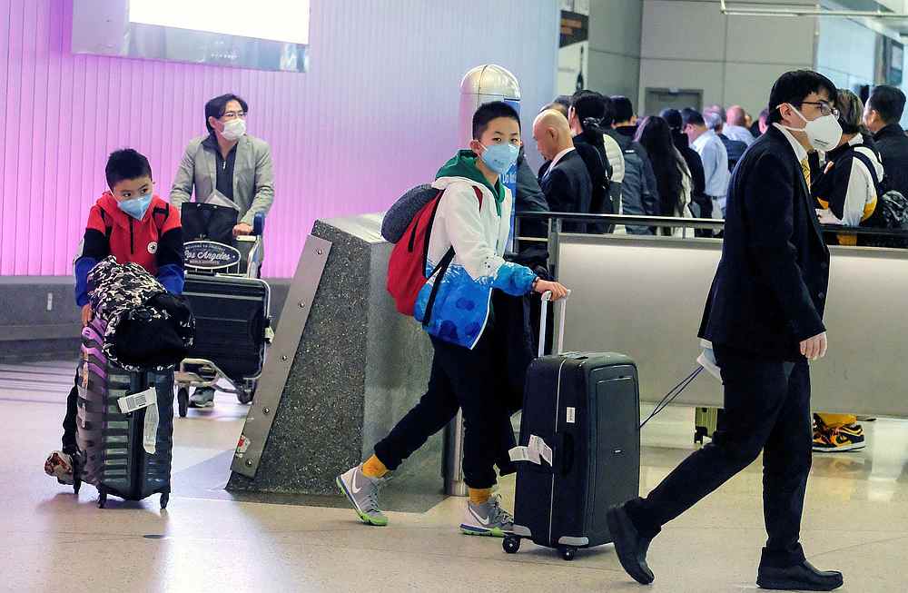 Passengers arrive at LAX from Shanghai, China, after a positive case of the coronavirus was announced in the Orange County suburb of Los Angeles, California January 26, 2020. u00e2u20acu201d Reuters pic