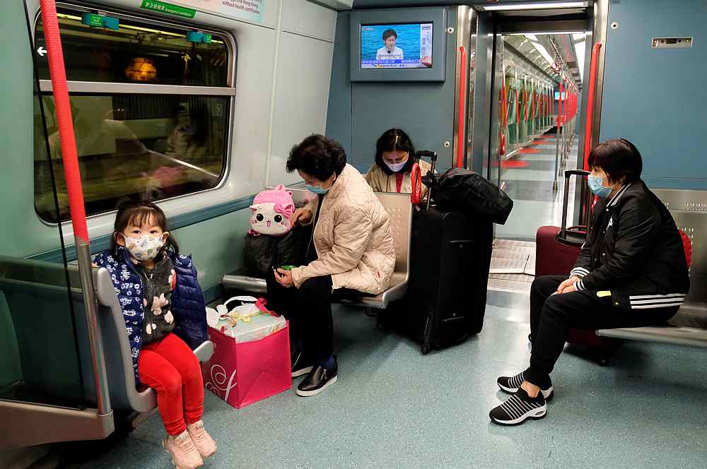 Passengers wear protective masks as they sit in a MTR train, following the outbreak of a new coronavirus, in Hong Kong February 4, 2020. u00e2u20acu201d Reuters pic