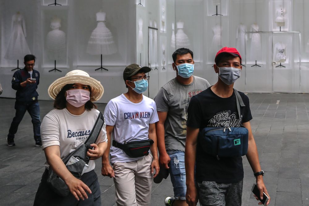 People wearing face masks are pictured outside Pavilion Kuala Lumpur February 10, 2020. u00e2u20acu201d Picture by Firdaus Latif