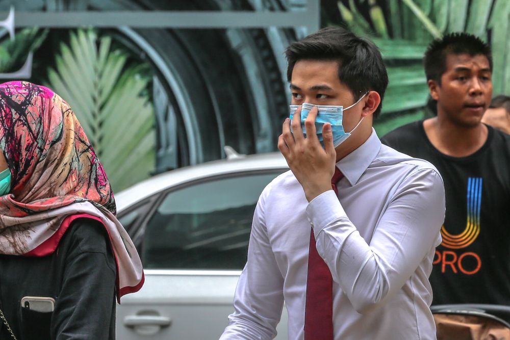 People wearing face masks are pictured outside Pavilion Kuala Lumpur February 10, 2020. u00e2u20acu201d Picture by Firdaus Latif