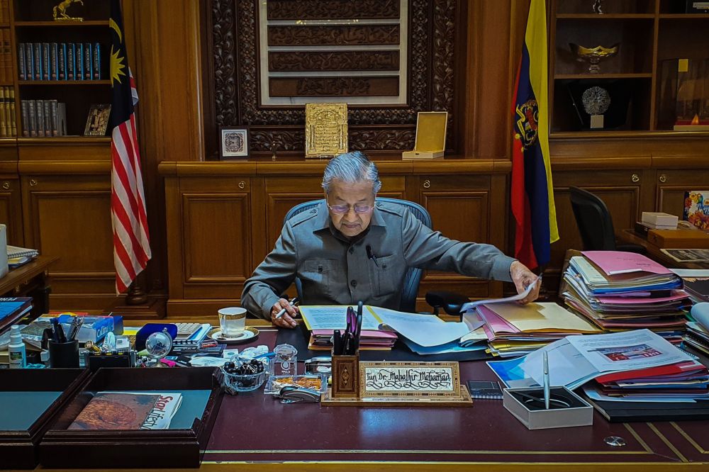 Interim prime minister Tun Dr Mahathir Mohamad gets down to business at Perdana Putra February 25, 2020. u00e2u20acu201d Picture via Twitter