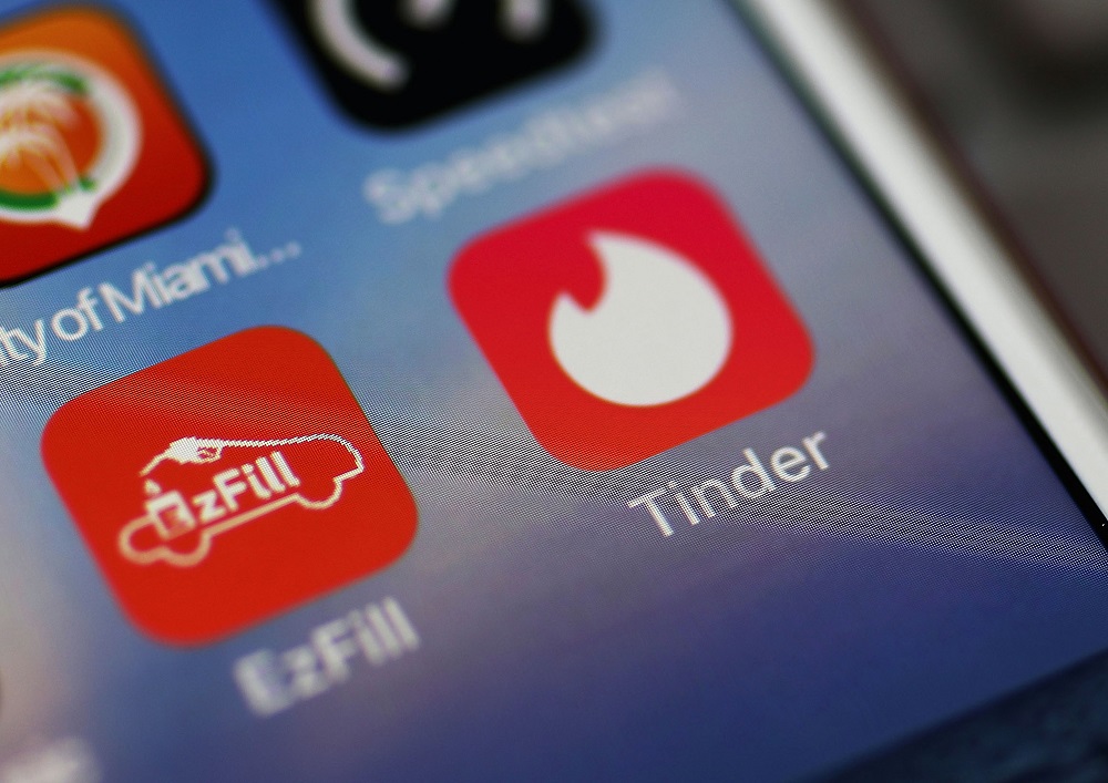 In this file photo illustration taken on August 14, 2018, the icon for the dating app Tinder is seen on the screen of an iPhone in Miami, Florida. u00e2u20acu201d AFP pic