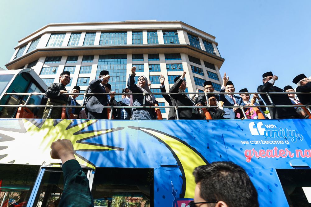 A bus ferrying PKR MPs arrives at Istana Negara February 26, 2020. u00e2u20acu2022 Picture Miera Zulyana