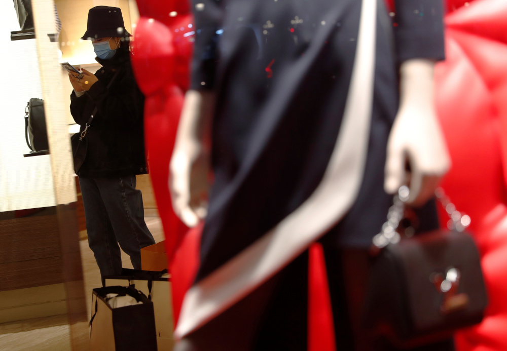 A tourist uses a protective mask inside a shop, amid the novel coronavirus outbreak, in Barcelona, Spain February 6, 2020. u00e2u20acu201d Reuters pic 