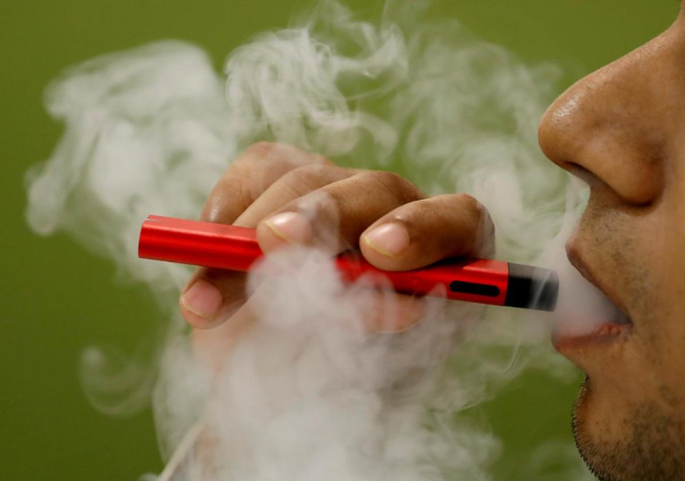 A man uses a vape device in this illustration picture, September 19, 2019. u00e2u20acu201d Reuters pic