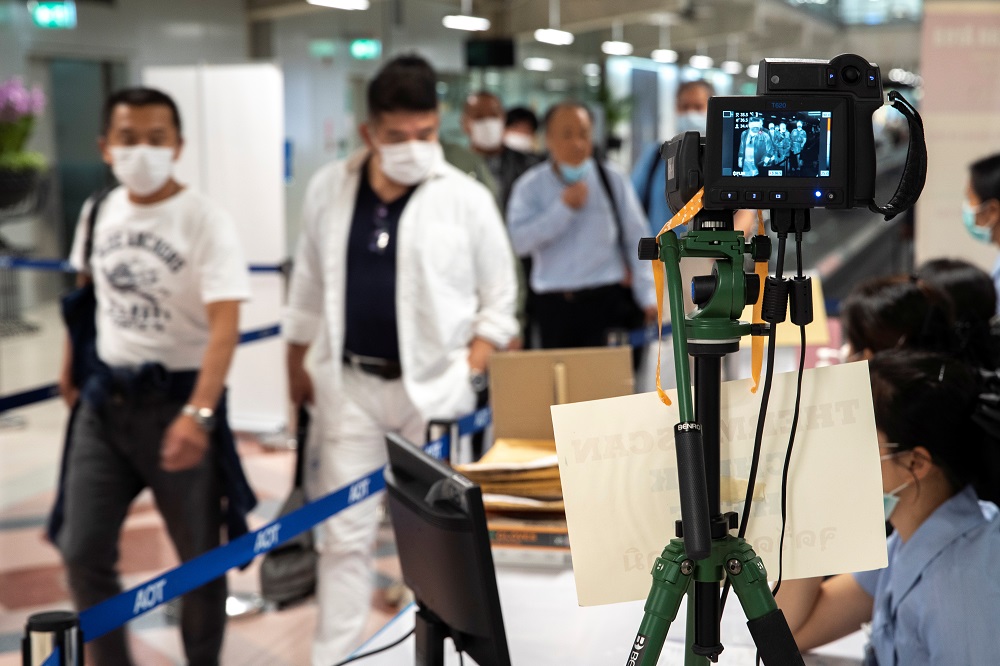 A thermographic device displays the temperature of arriving passengers before they enter immigrations at Bangkoku00e2u20acu2122s Suvarnabhumi International Airport in Thailand March 14, 2020. u00e2u20acu201d Reuters pic