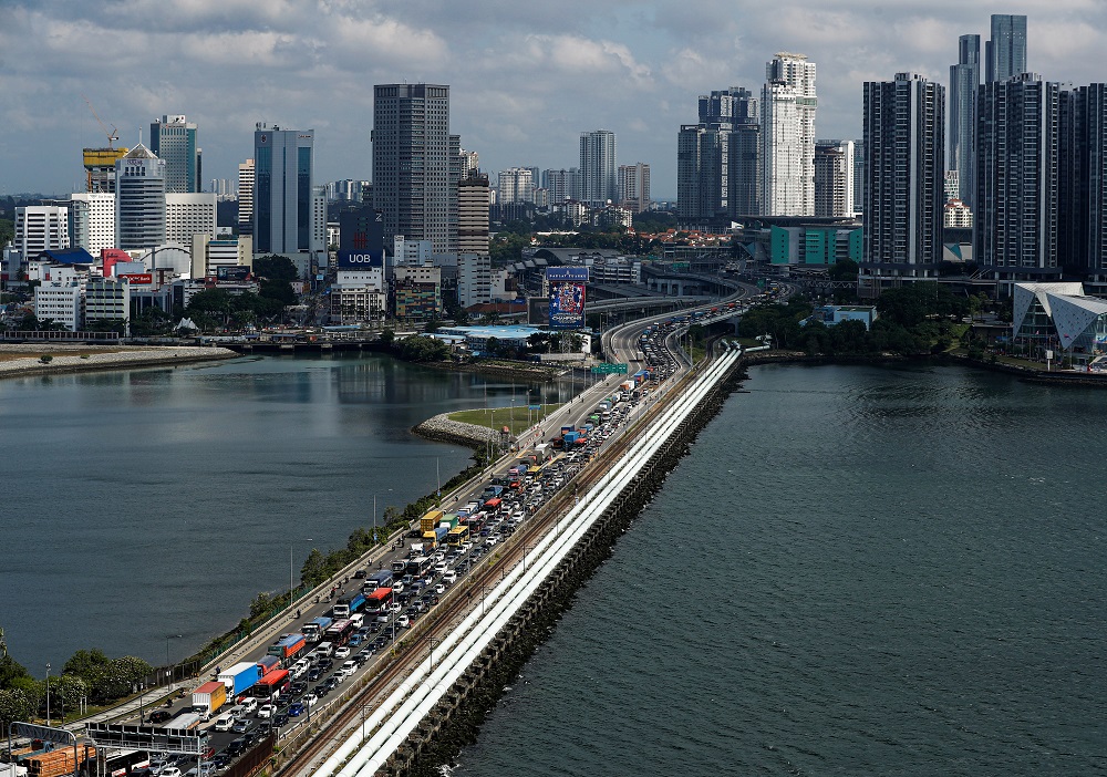 Commuters take the Woodlands Causeway to Singapore from Johor a day before Malaysia imposes a lockdown on travel due to the coronavirus outbreak in Singapore March 17, 2020. u00e2u20acu201d Reuters pic
