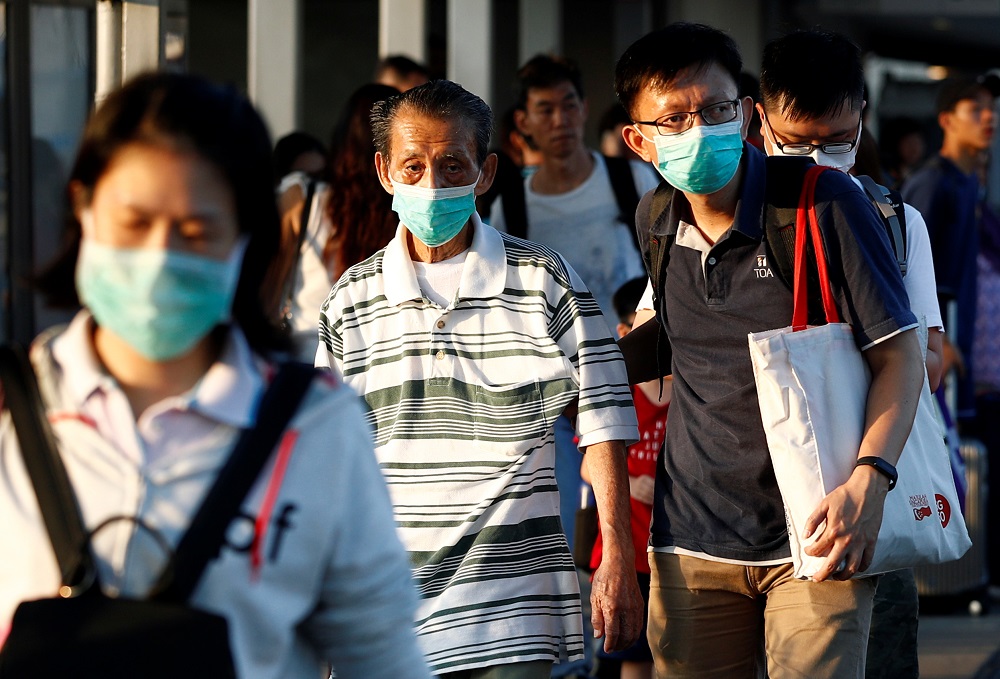 Commuters leave the Woodlands Causeway across to Singapore from Johor, hours before Malaysia imposes a lockdown on travel due to the coronavirus outbreak, in Singapore March 17, 2020. u00e2u20acu201d Reuters pic