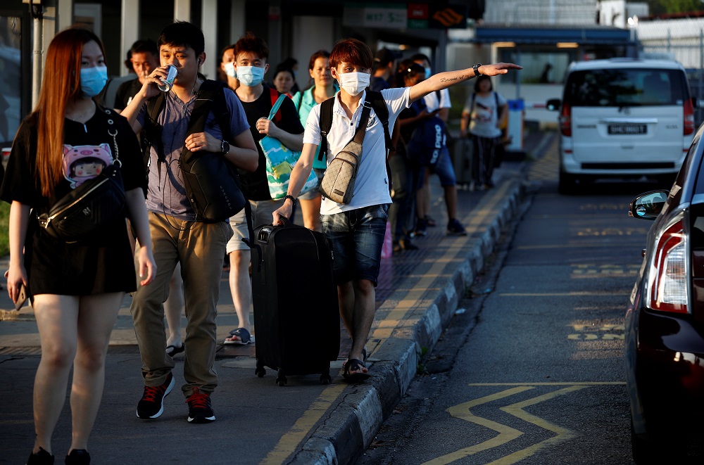 Commuters leave the Woodlands Causeway across to Singapore from Johor, hours before Malaysia imposes a movement control order on travel due to the coronavirus outbreak, in Singapore March 17, 2020. u00e2u20acu201d Reuters pic