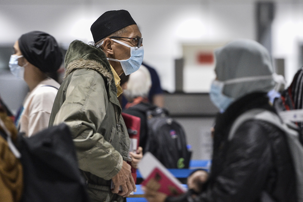 Passengers wearing masks at KLIA March 10, 2020. u00e2u20acu201d Picture by Miera Zulyana