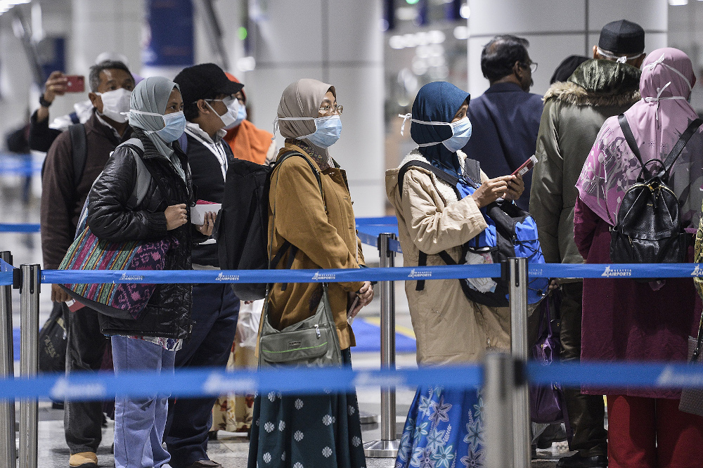 Passengers wearing masks at KLIA March 10, 2020. u00e2u20acu201d Picture by Miera Zulyana