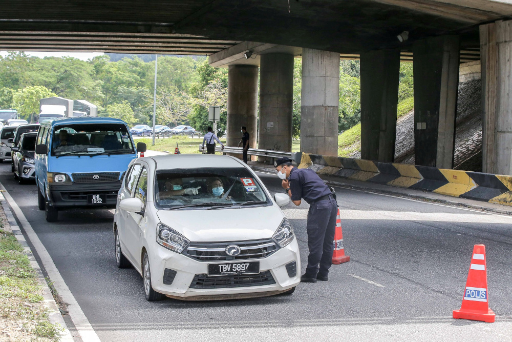 A police road block is seen at Jalan Kuala Kangsar following the movement control order to curb the spread of Covid-19 infection March 20, 2020. u00e2u20acu201d Picture by Farhan Najib