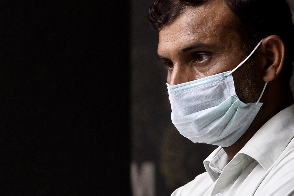 A man is seen wearing a face mask during the movement control order in Kuala Lumpur March 24,2020. u00e2u20acu201d Picture by Miera Zulyana 