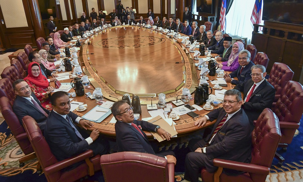 Prime Minister Tan Sri Muhyiddin Yassin poses with Cabinet ministers before the first new Cabinet meeting at the Perdana Putra in Putrajaya March 11, 2020. u00e2u20acu201d Bernama pic