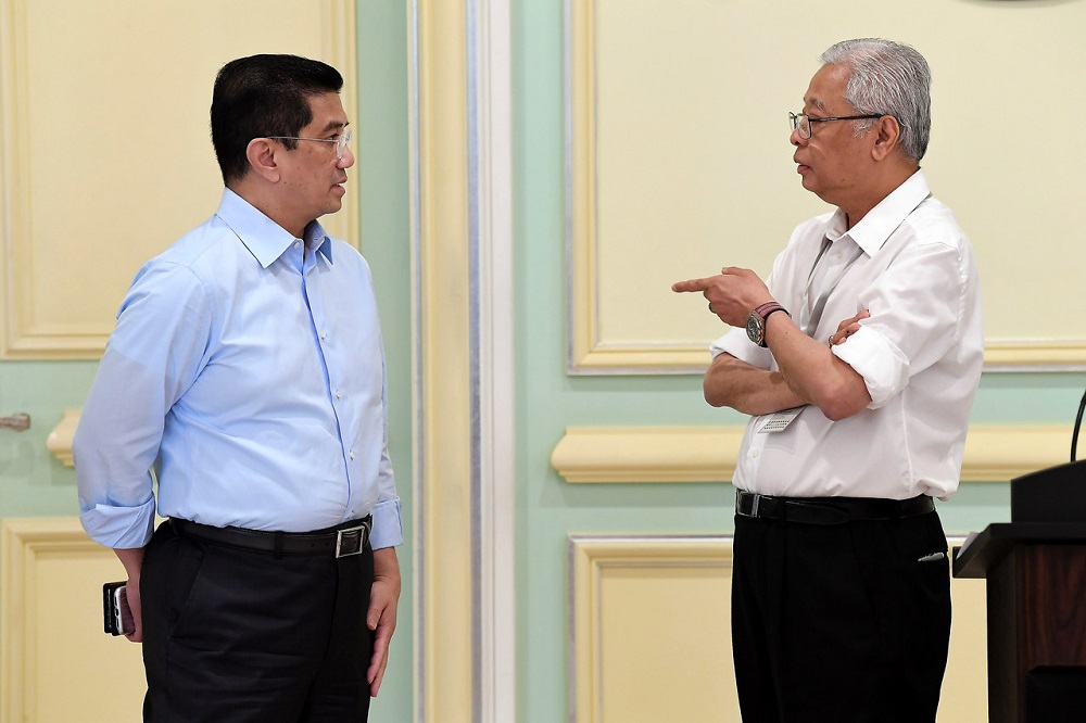 International Trade and Industry Minister Datuk Seri Mohamed Azmin Ali (left) and fellow Senior Minister Datuk Seri Ismail Sabri Yaakob during a press conference in Putrajaya March 24, 2020. u00e2u20acu201d Bernama pic