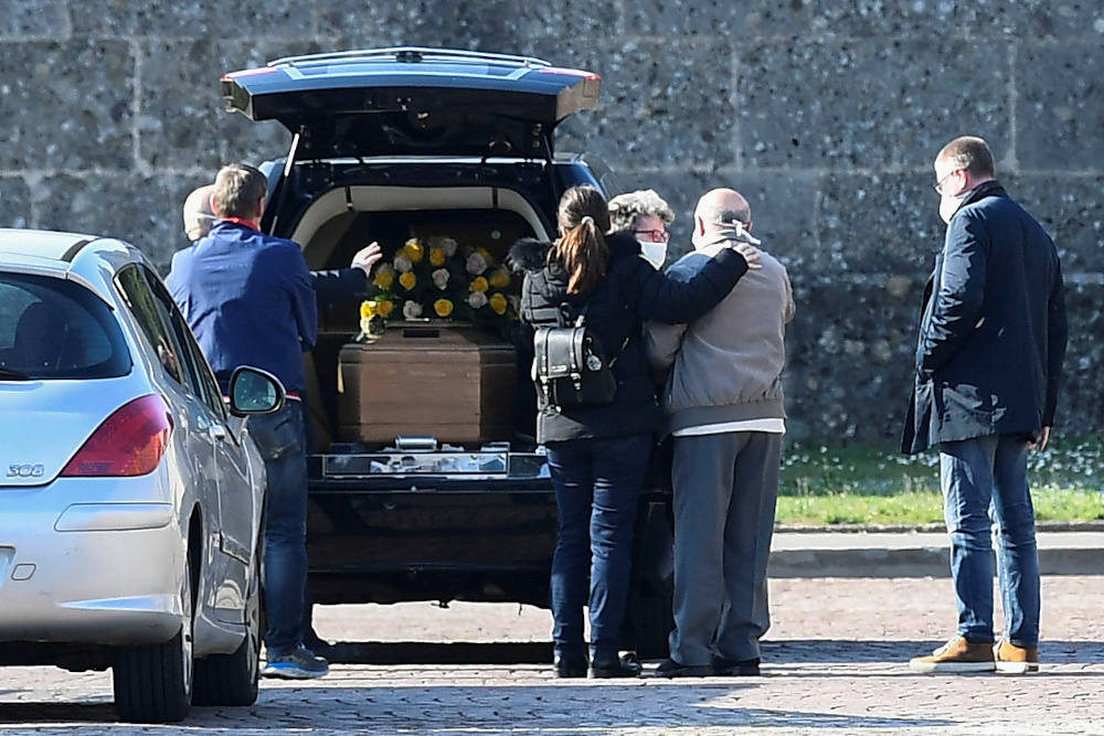 Relatives of a person who died from coronavirus disease arrive at a cemetery in Bergamo, Italy March 16, 2020. u00e2u20acu201d Reuters pic 