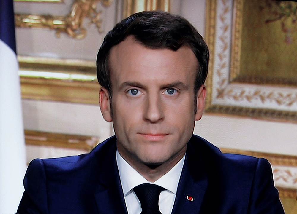 French President Emmanuel Macron is seen addressing the nation about the Covid-19 outbreak, on a television screen taken March 16, 2020. u00e2u20acu201d Reuters pic