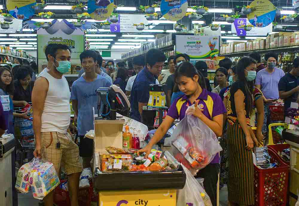A crowd of people stock up, as Myanmaru00e2u20acu2122s Health and Sport Ministry announced first two confirmed Covid-19 cases, at the shopping centre in Yangon, Myanmar March 23, 2020. u00e2u20acu201d Reuters pic