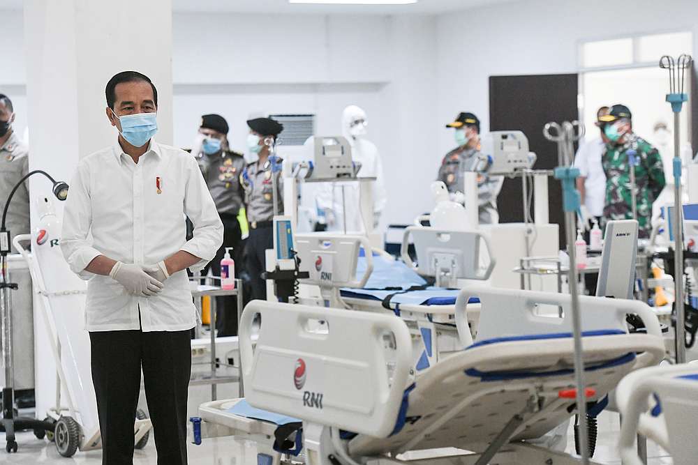 Indonesia's President Joko Widodo takes a look at the emergency hospital handling of Covid-19 in Kemayoran Athletes Village, in Jakarta March 23, 2020. u00e2u20acu201d Antara Foto/Hafidz Mubarak A pic via Reuters 