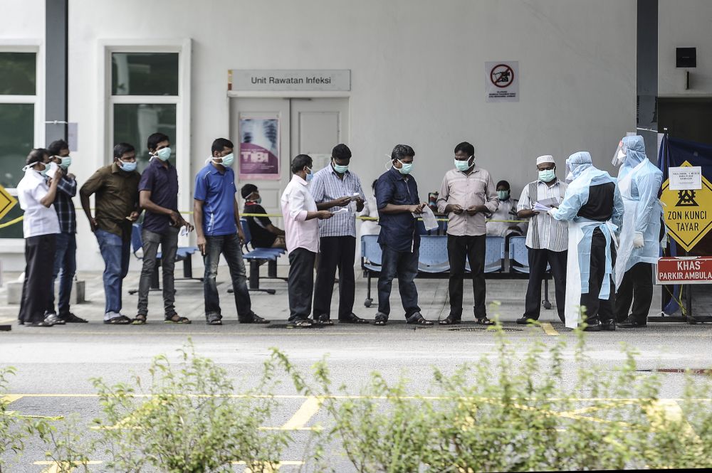 Government health workers attend to members of the public at the Kuala Lumpur Health Clinic March 24, 2020. u00e2u20acu201d Picture by Shafwan Zaidonnn