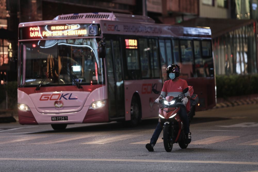 A Foodpanda rider is pictured in Kuala Lumpur on day seven of the movement control order in Kuala Lumpur March 24, 2020. u00e2u20acu201d Picture by Ahmad Zamzahuri