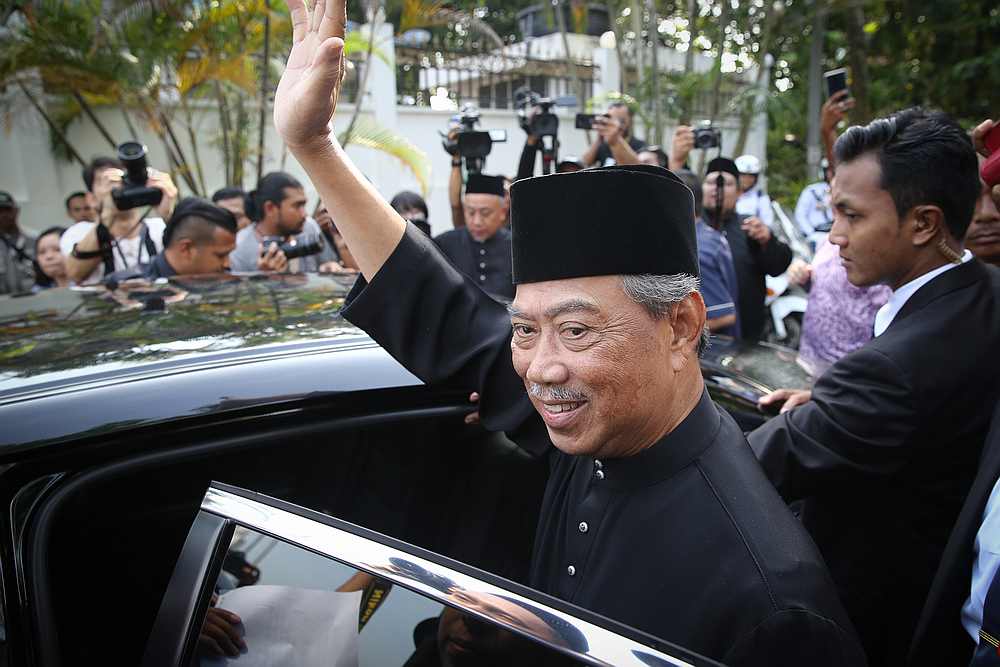 Tan Sri Muhyiddin Yassin waves before heading for the Istana Negara in Kuala Lumpur March 1, 2020. u00e2u20acu201d Picture by Yusof Mat Isa