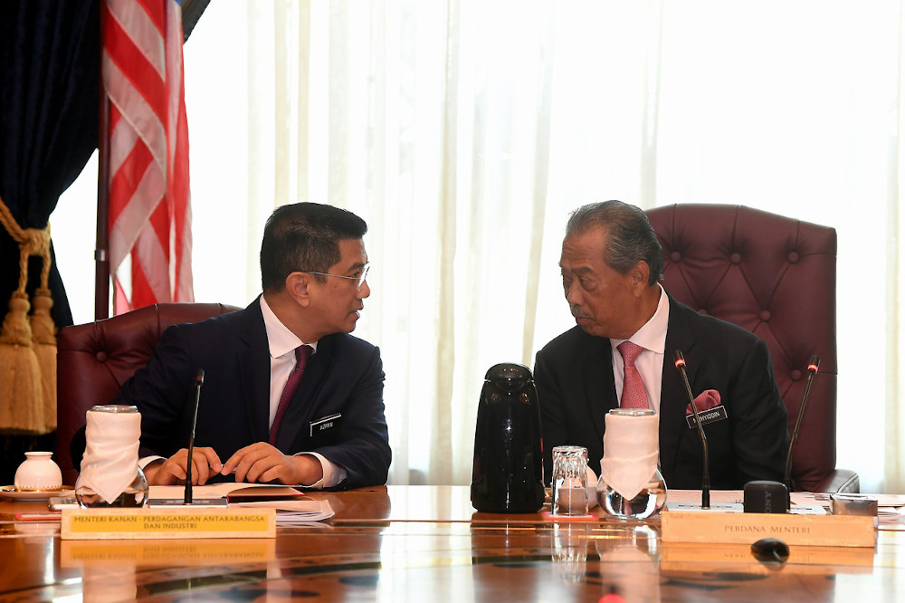 Prime Minister Tan Sri Muhyiddin Yassin chairs the first new Cabinet meeting at the Perdana Putra in Putrajaya March 11, 2020. With him is Datuk Seri Mohamed Azmin Ali. u00e2u20acu201d Bernama pic