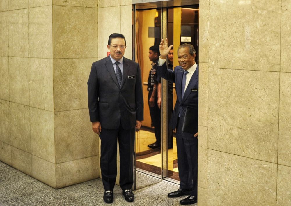 Prime Minister Tan Sri Muhyiddin Yassin (right) is pictured with Chief Secretary to the Government Datuk Seri Mohd Zuki Ali at Putra Perdana March 2, 2020. u00e2u20acu201d Picture by Shafwan Zaidon 