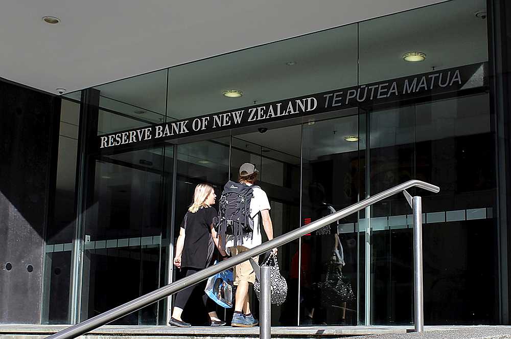 Two people walk towards the entrance of the Reserve Bank of New Zealand located in the New Zealand capital city of Wellington, March 22, 2016. u00e2u20acu201d Reuters pic