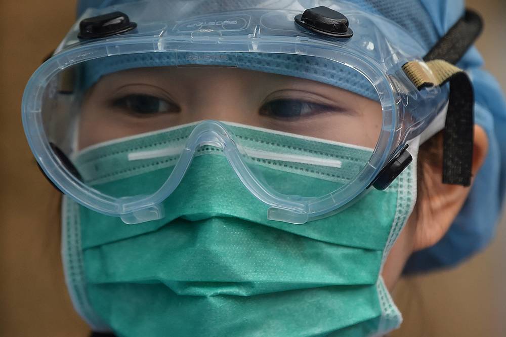 A medical worker wearing protective clothing as a preventive measure against Covid-19, stands at Xuhui District Hospital in Shanghai. u00e2u20acu201d AFP pic
