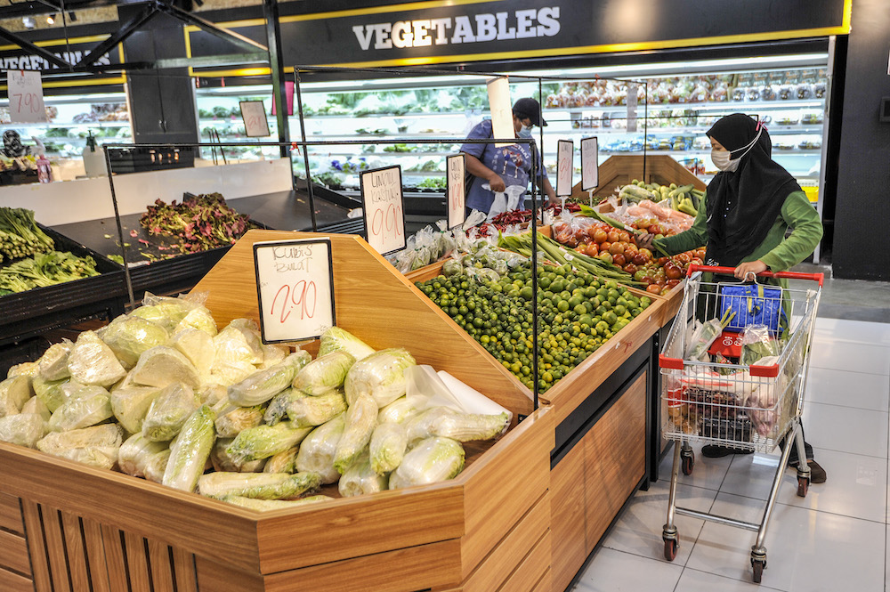 A customer buying a groceries at a supermarket in Cyberjaya April 5, 2020. u00e2u20acu201d Picture by Shafwan Zaidon